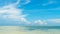 Beautiful panorama of horizon with hazy white tropical clouds above tropical blue empty sea.