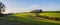 A beautiful panorama of new crops on farmland in Combe Valley, East Sussex, England