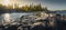 Beautiful panorama of a rocky shore. Nordic sunrise or sunset.  Close-up of  big stones