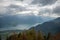 Beautiful panorama scene of lake Thun with mountain and cloudy sky with sunlight looking from harder kulm