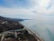 Beautiful panorama of the sea landscape in the rays of the sun in clear weather. Sea coast from altitude