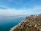 Beautiful panorama of the sea landscape in the rays of the sun in clear weather. Sea coast from altitude