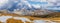 Beautiful panorama of snow covered Australian Alps and yellow gr