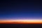 Beautiful panorama of sunset from height of airplane. Dark sunrise