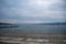 Beautiful panorama view of Limmat river looking from public park at Zurich midtown with cloudy sky