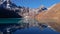 Beautiful panorama view over peaceful Gokyo lake, Himalayas, Nepal with craggy mountains and challenging Renjo La pass.