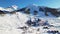 Beautiful panoramic aerial drone view of Sestriere village from above, famous ski resort in italian western Alps. Skiing