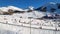 Beautiful panoramic aerial drone view of Sestriere village from above, famous ski resort in italian western Alps. Skiing