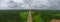 Beautiful panoramic the long road leading to the mountains with storm clouds and Coconut plantations and palm plantations between