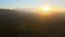 Beautiful panoramic mountain landscape with hazy peaks and foggy valley at sunset