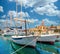 Beautiful panoramic picturesque view of a small town of Milna on the island of Brac. Old boats docked in the crystal clear sea,