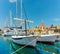 Beautiful panoramic picturesque view of a small town of Milna on the island of Brac. Old boats docked in the crystal clear sea,