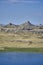 Beautiful panoramic summer steppe landscape of stone mountains