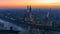 Beautiful panoramic sunset view of old town of Verona, Torre Lamberti and Santa Anastasia bell tower covered with evening fog.