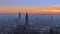 Beautiful panoramic sunset view of old town of Verona, Torre Lamberti and Santa Anastasia bell tower covered with evening fog.