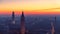 Beautiful panoramic sunset view of old town of Verona, Torre Lamberti and Santa Anastasia bell tower covered with evening fog.