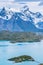 Beautiful panoramic view of aqua blue Pehoe lake with small island with nature cuernos mountains peak with cloud in autumn, Torres