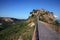 Beautiful panoramic view of famous Civita di Bagnoregio with Tiber river valley in golden evening light, Lazio