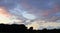 Beautiful panoramic view on orange and yellow sunset clouds in a dramatic looking sky