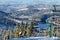 Beautiful panoramic view over the `Marisel` ski slope in winter season and Belis lake in the valley, Cluj county Romania