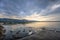 Beautiful Panoramic view of Rapperswil, Switzerland: ducks and swans on Lake Zurich with mountain ranges and sunset as background.