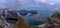 Beautiful panoramic view from Reinebringen edge on stunning mountains and village of Reine, Lofoten Islands, Norway