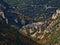 Beautiful panoramic view of steep canyon Gorges de la Nesque with rugged limestone rocks on the slopes in France.