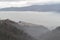 Beautiful panoramic view to heavy foggy landscape of the Calolziocorte valley near Lecco.