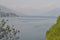 Beautiful panoramic view to the lake Como, lakefront, motorboat moving.
