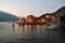Beautiful panoramic view to the Varenna pier, lakefront and the lake Como at sunset in spring.