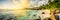 Beautiful panoramic view of a tropical beach with a cloudy sunset, illustrator ai generative