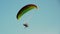 Beautiful paraglider on a background of blue sky. Paragliding.