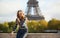 Beautiful Parisian girl near the Eiffel tower