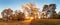 Beautiful park garden in atumn. Fall panorama in park at sunrise