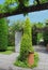 Beautiful parks and gardens - thuja cultivar with a terracota pottery piece