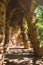 Beautiful passage inside Park Guell with rays of morning sun