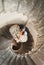 Beautiful, passionate wedding couple posing on stairs