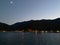 Beautiful Patagonia landscape of Andes mountain range with high mountains with illuminated peaks, stones in mountain lake,