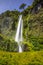 Beautiful Patagonian waterfall in a forest lit by the rising sun of Patagonia