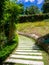 Beautiful pathway in a park in summer, Landscape with scenic winding footpath in sunlight