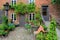 Beautiful patio of old house with flowers, royal town Ribe, Denmark