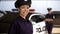 Beautiful patrolwoman smiling near police car, police academy advertisement