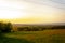 Beautiful and peaceful field with electrical transmitters during sunny day