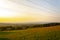 Beautiful and peaceful field with electrical transmitters during sunny day