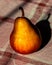 Beautiful pear stands on the tablecloth