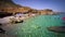 Beautiful pebble beach with transparent sea in Sicily.