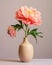 Beautiful peony flowers in vase isolated on grey background.