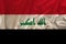 Beautiful photo of the colored national flag of the modern state of Iraq on textural fabric, concept of tourism, emigration,