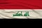 Beautiful photo of the colored national flag of the modern state of Iraq on textural fabric, concept of tourism, emigration,