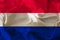 Beautiful photo of the colored national flag of the modern state of the Netherlands on textural fabric, concept of tourism,